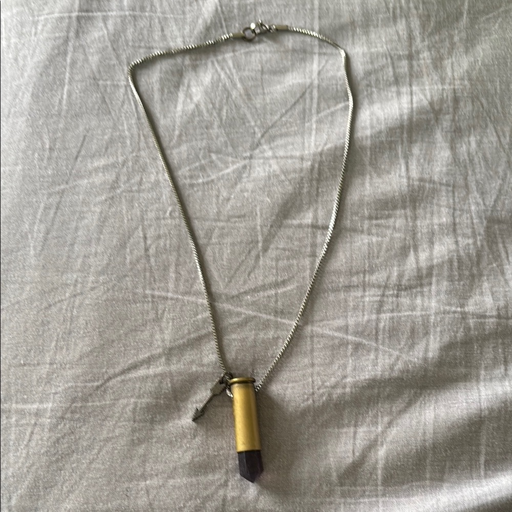 Handmade necklace. Purple crystal set in bullet casing